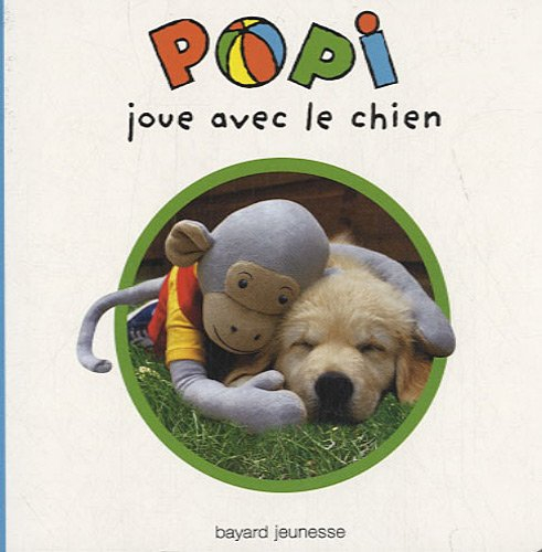 Popi. Popi joue avec le chien